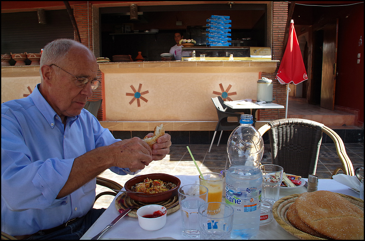 My dad eating omelets, fresh baked bread, and fresh squeezed orange juice at a roadside café just at the foot of the mountains