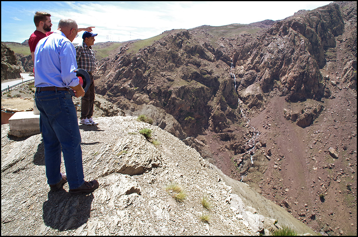 My dad, brother Dan, and our guide Salah overlooking a valley in the Atlas Mountains of Morocco. Notice the stream of water way behind them? 