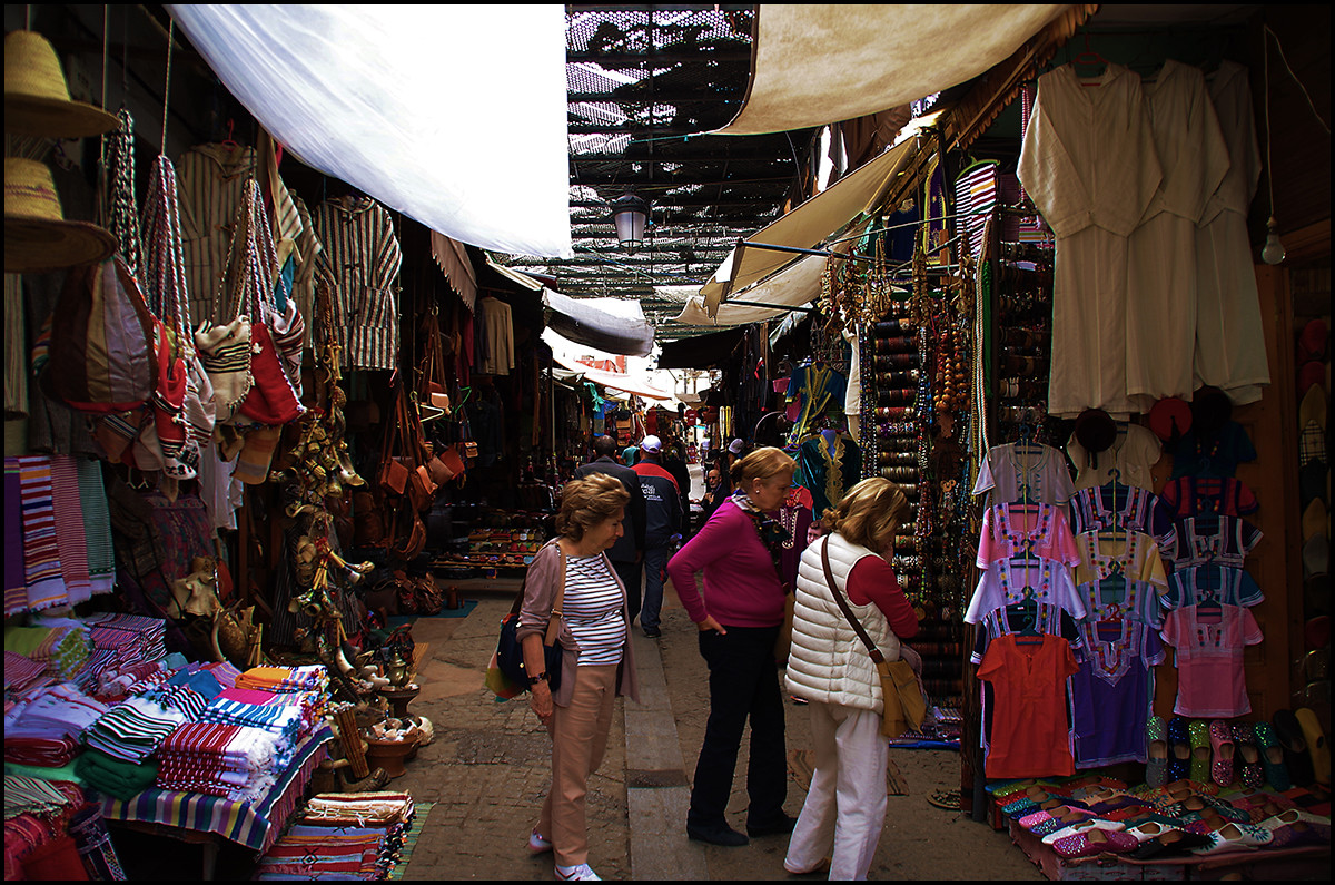 Morocco: European tourists shopping in the Rabat Medina